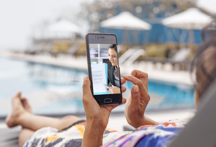 Person on a video call with a notary on her phone